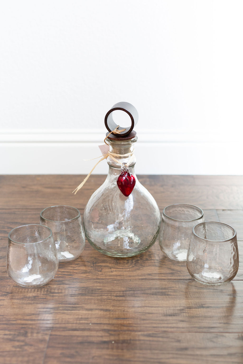 Hammered Glass Decanter with Iron Stopper and four Matching Glasses.